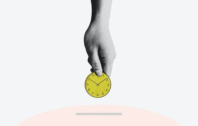 a hand holding a small clock and putting it in a piggy bank as though it were a coin