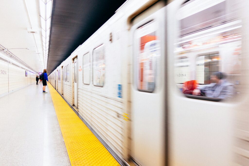 Man waiting for Subway train at Spadina Station in Toronto, Canada